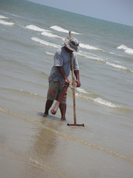 people dredging the bottom for mussels