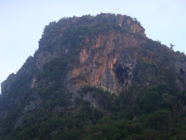 Suddenly, the rock face around the cave entrance started to turn a reddish colour.