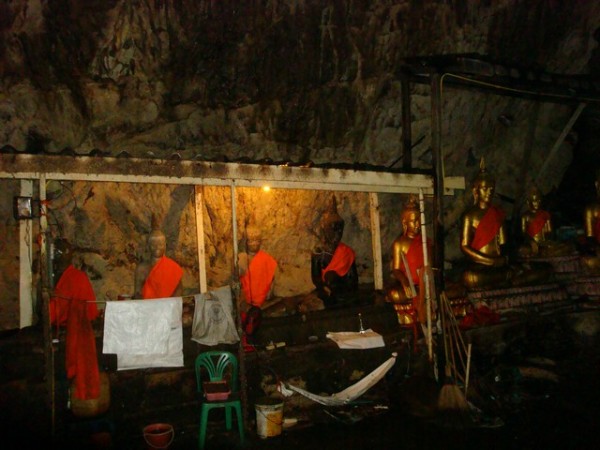 dimly lit Buddha images