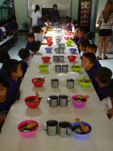 small dishes were place in front of each of them, but they just sat there, still and quiet