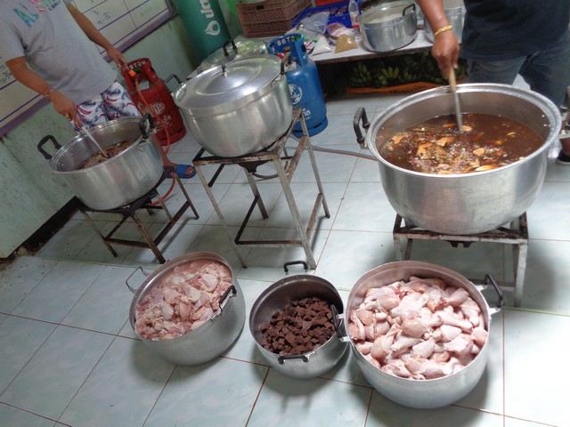 Chicken and congealed blood (yuk) ready to add to the pot.