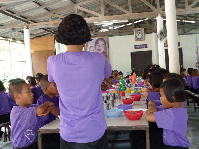 head girl leading them through the Thai equivalent of grace