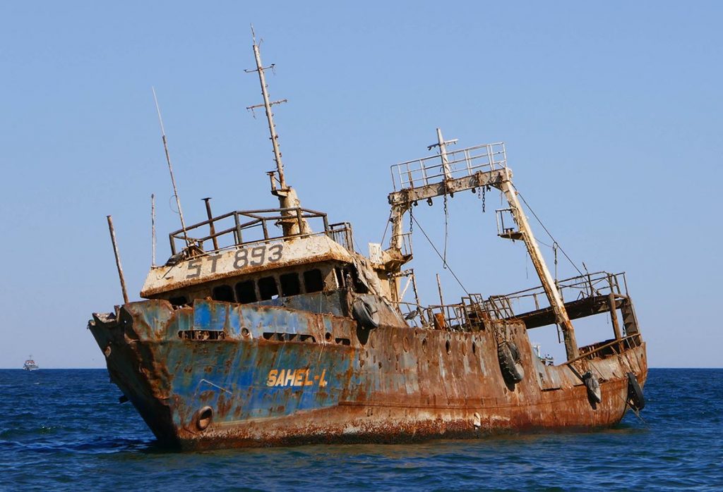 Rusted-Out-Sahel-L-Abandoned-in-Shallow-Water-in-Noaudhibou-Mauritania-1024x698.jpg