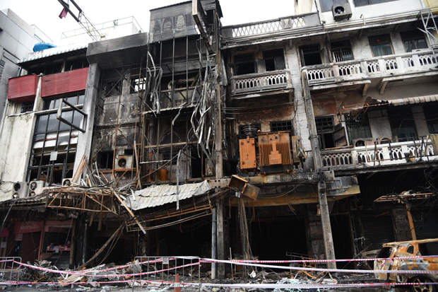 The burned electrical transformer and fire gutted shops after Sunday's blaze in Sampheng area, popular with bargain-hunting shoppers, in Bangkok's Samphanthawong district. (Photo: Engineering Institute of Thailand Facebook account)