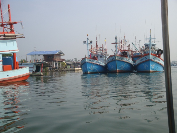 Travelling down the river passing the Pak Nam Pran fishing fleet.