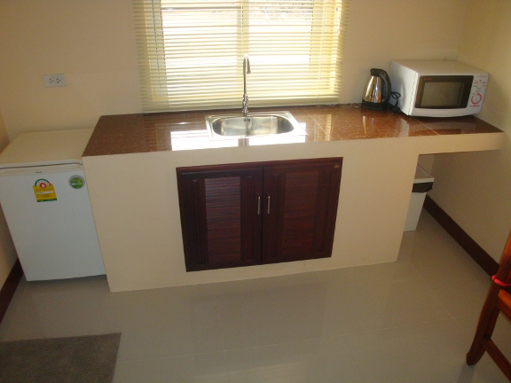 Inside a bungalow looking towards the kitchen area.