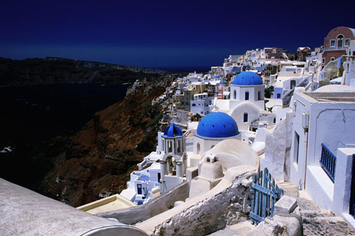 white-washed-houses-and-blue-domes-on-cliff-top-are-just-so-typically-greek.jpg