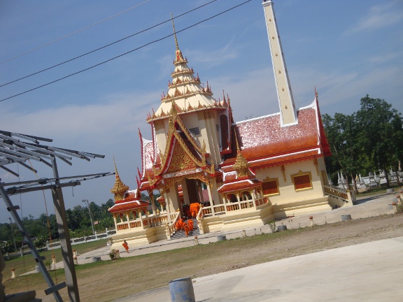 young boys in Buddha robes entering this temple