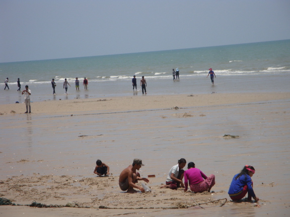 a few people making use of the sea along here, but there were even more (I guess Burmese) digging huge trenches in search of small shellfish