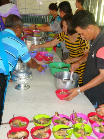 Our team of volunteers preparing the dishes conveyor belt style