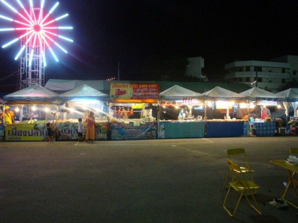 Surrounding the tables on 2 sides are food and drink stalls