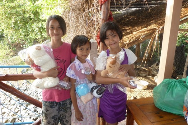 Happy girls with their cuddly toys: