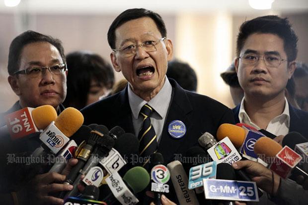 Paiboon Nititawan, centre, leader of the People Reform Party, speaks to the media after submitting a letter to the Election Commission asking if Thai Raksa Chart Party violated the law in nominating Princess...