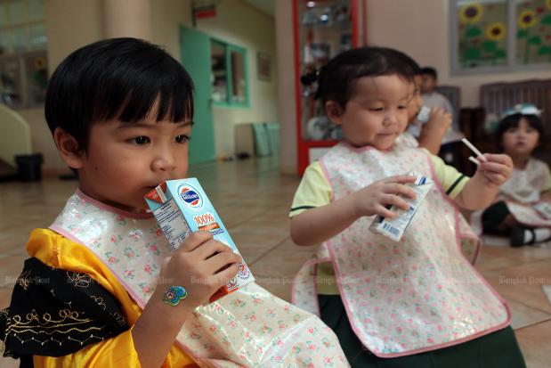 Pupils at Anuan Tantawan School in Bang Bon district drink milk during a class break on Sept 5, 2018.