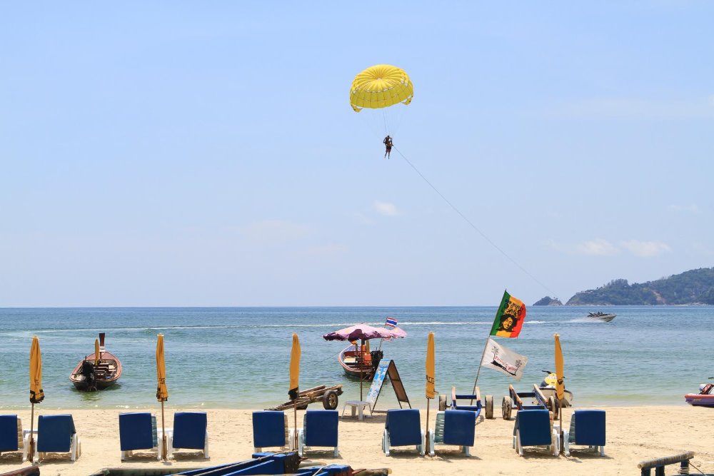 Foreign tourists relax at Patong Beach.  TAWATCHAI KEMGUMNERD