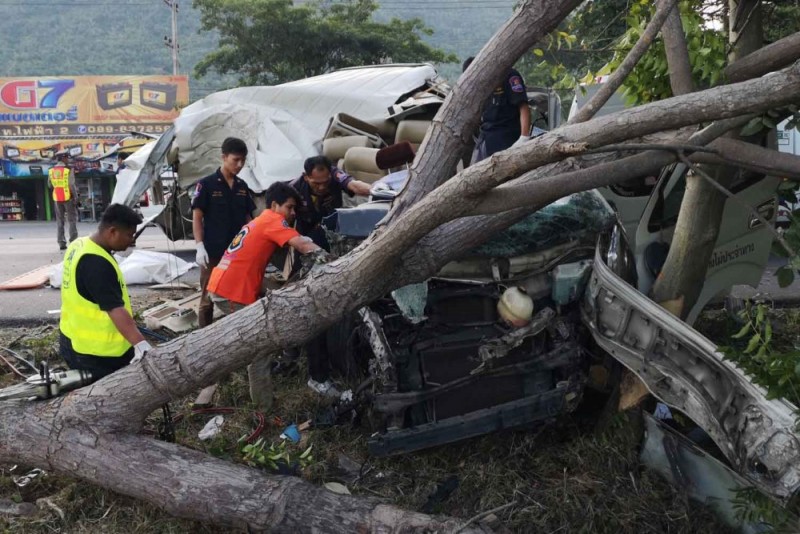 Rescue workers at the scene of the crash which claimed the life of the van driver and three passengers, in Muang district of Prachuap Khiri Khan, on Monday morning. (Photo by Chaiwat Satyam)