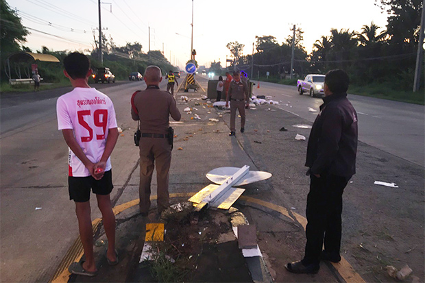 Police at the scene where a car hit a motorcycle and sidecar in Chok Chai district of Nakhon Ratchasima on Monday. (Photo by Prasit Tangprasert)